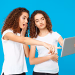 two-womans-twins-looking-tablet-surprised-blue_176420-14631